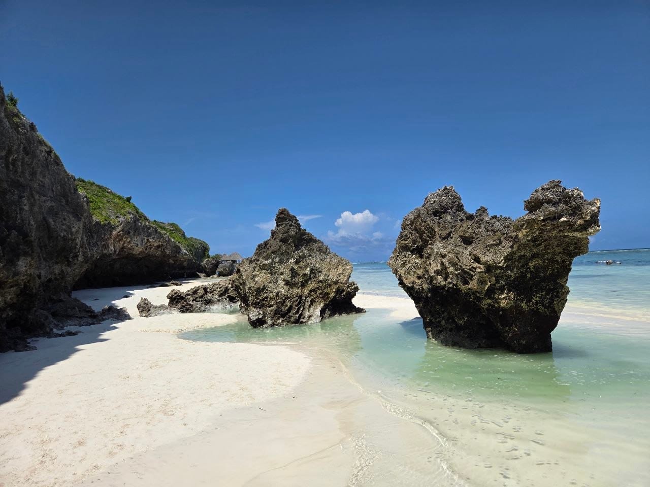 White sand beach with rock formations
