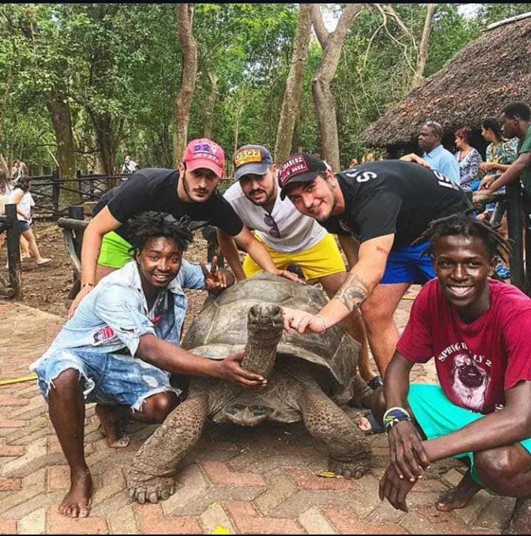Group with giant tortoise at Prison Island